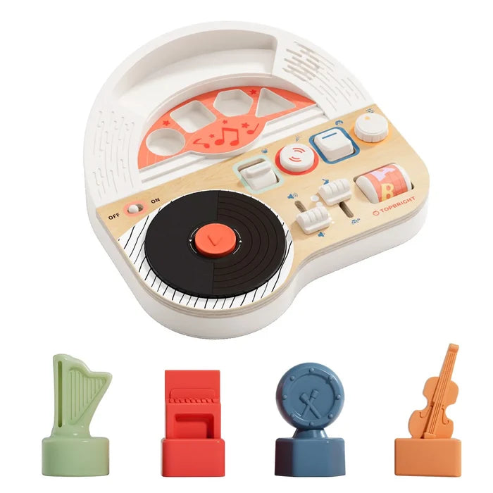 White and wood toy music station with a black record, sliders, and harp, piano, drum, and violin figurines.