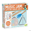 Orange and white box with a clear window showing a blue maraca, triangle, tambourine, and wooden rhythm sticks.