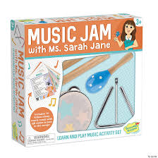 Orange and white box with a clear window showing a blue maraca, triangle, tambourine, and wooden rhythm sticks.