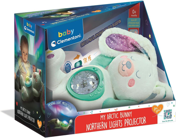 Plush white bunny with a green light projector on its belly and purple ears, shown in its blue and red retail box.