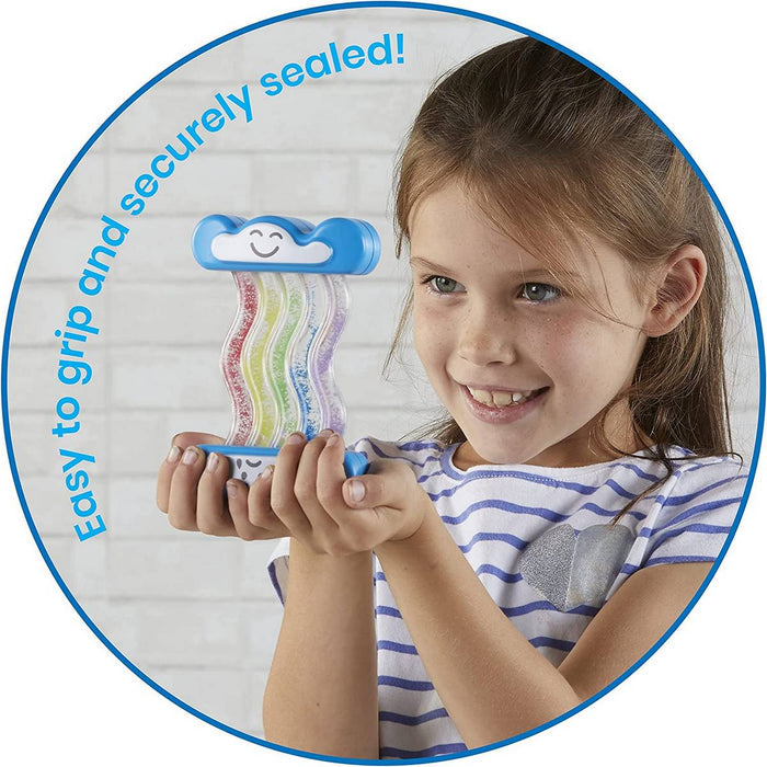 Young girl holding a blue cloud-shaped toy with three wavy tubes filled with colorful beads.