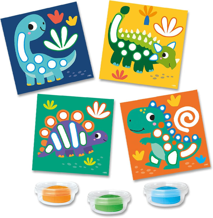 Four square dinosaur cards with white shape cutouts and three containers of orange, green, and blue play dough.