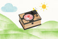 Wooden toy record player with black tonearm and pink disc, set against an illustrated green hill and sun background.