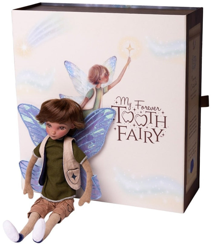 Boy fairy doll with iridescent wings and brown hair sitting by an illustrated book-shaped gift box.