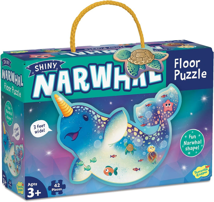 Teal box for a 42-piece shiny narwhal floor puzzle featuring a cartoon blue narwhal and a yellow rope handle.