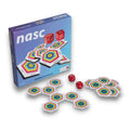 Blue board game box labeled nasc with rainbow-ringed hexagonal tiles and two red dice.