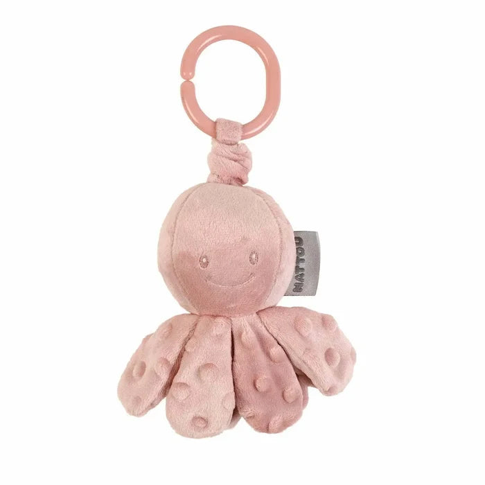 Dusty pink plush octopus toy with a smiling face and bumpy tentacles, hanging from a pink plastic ring.