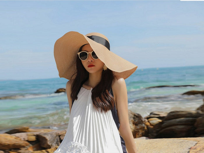 Navy wide brim sun straw hat for women, floppy derby style, perfect for summer beach wear, by dealonline.co.nz