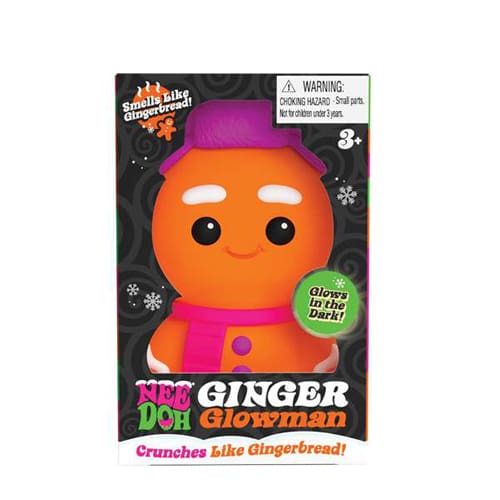 Orange gingerbread man toy in black packaging with a purple hat and pink scarf. Features glow-in-the-dark and scented text.