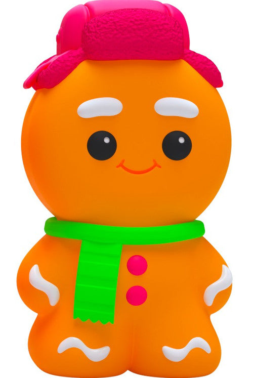 Orange gingerbread man squishy toy wearing a pink winter hat and green scarf with white icing details.