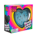 Teal heart-shaped squishy toy with PEACE text and glitter inside a vibrant rainbow-themed display box.