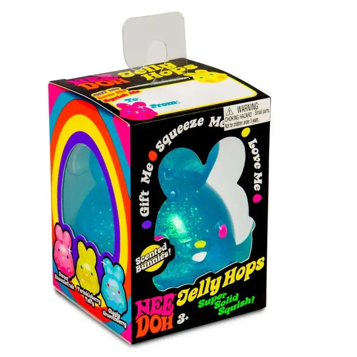 Translucent blue glitter bunny squishy toy in a black box with neon rainbow graphics and NeeDoh Jelly Hops branding.