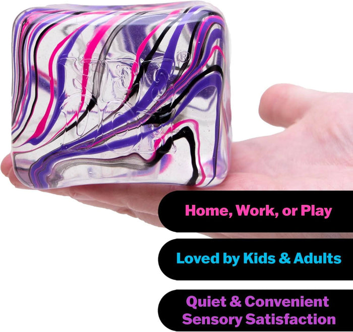 Squishy cube with pink, purple, and black swirls held in a hand, featuring text for sensory satisfaction.