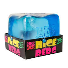 Translucent blue iceberg-shaped squishy toy in a black box with bright pink, yellow, and green lettering.
