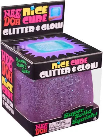 Translucent purple glitter squishy cube toy in a black box with bright pink, yellow, and green text.
