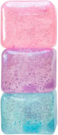Vertical stack of three translucent, glittery squishy cubes in bright pink, purple, and light blue.