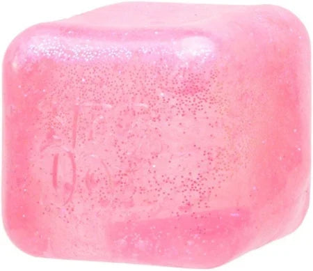 Translucent pink squishy cube with rounded edges, filled with shimmering pink glitter.