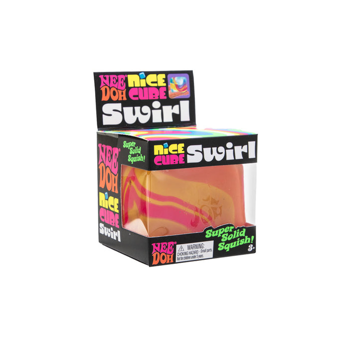 Pink and yellow swirled squishy cube toy in a colorful black retail box with a clear plastic window.