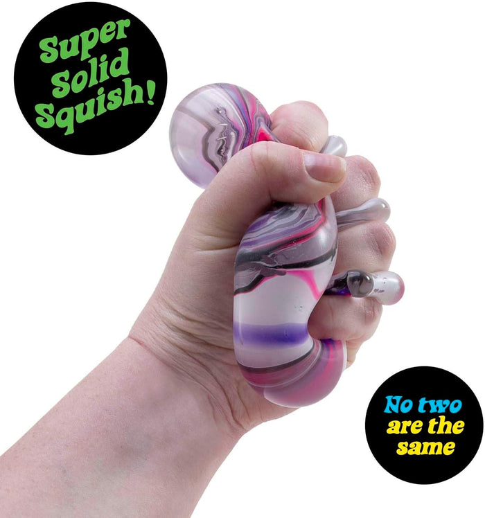 Hand squeezing a marble-patterned pink and purple squishy toy that bulges between fingers.