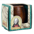 Dark brown wooden barrel puzzle inside a teal and cream nautical box with a portrait of Horatio Nelson.