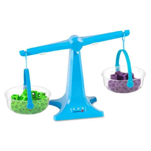 Bright blue toy balance scale with clear pans filled with small green and purple plastic linking cubes.