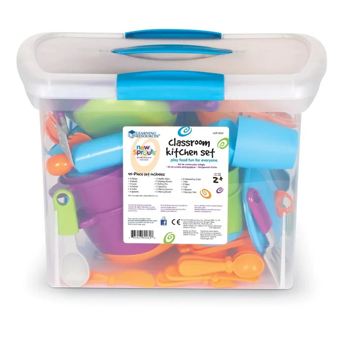 Clear plastic storage bin with blue lid filled with colorful toy plates, bowls, cups, and utensils.