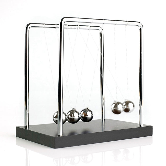 Five polished silver spheres hanging from a chrome frame on a black base, with two balls swinging to the side.
