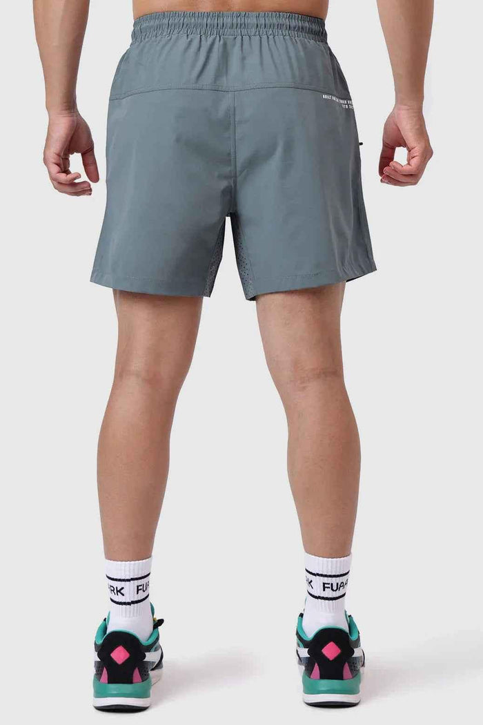 Forest green Fuaark Nz Nova Shorts displayed on a model, showcasing casual fit and comfortable design.