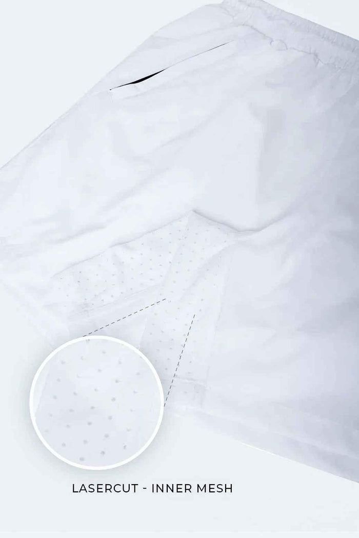 White Nova Shorts by Fuaark Nz, lightweight casual shorts with an elastic waistband and relaxed fit, shown on a model.