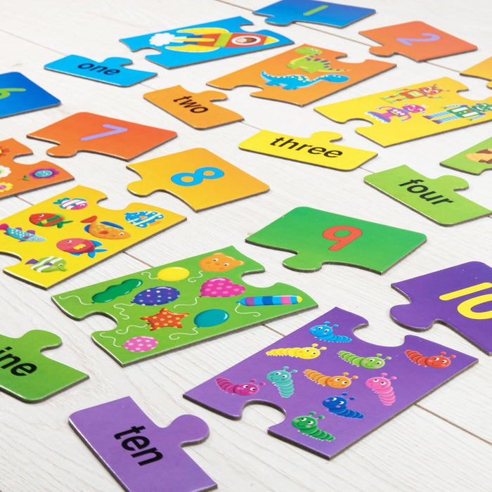 Brightly colored number puzzle pieces featuring digits, words, and matching character illustrations on a wood surface.
