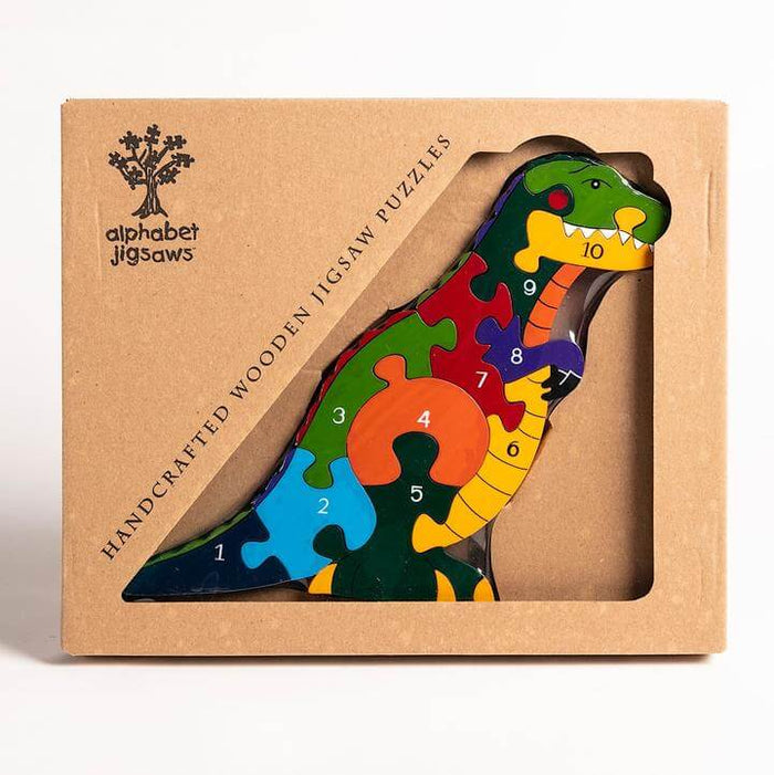 Colorful wooden T-Rex jigsaw puzzle with 10 numbered pieces in a brown cardboard window box.