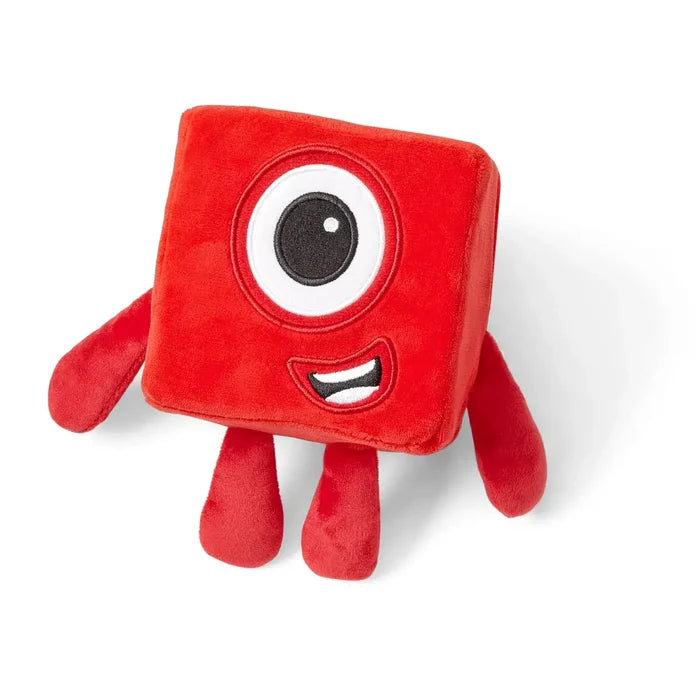 Red cube-shaped plush toy with a single large eye, a smiling mouth, and four short red limbs.
