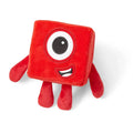 Red cube-shaped plush toy with a single large eye, a smiling mouth, and four short red limbs.