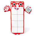Rectangular white plush toy with ten blocks, red trim, red star eyes, smiling face, and red arms with a star on one hand.