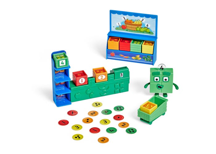 Numberblocks toy market set with blue stalls, green character figure, numbered blocks, and colorful counting tokens.