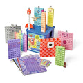 Colorful Numberblocks characters built from snap cubes with faces, activity cards, and a blue storage bin.