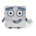 Square grey plush toy with a 3x3 grid, large blue-framed eyes, a smile, small limbs, and product tag.