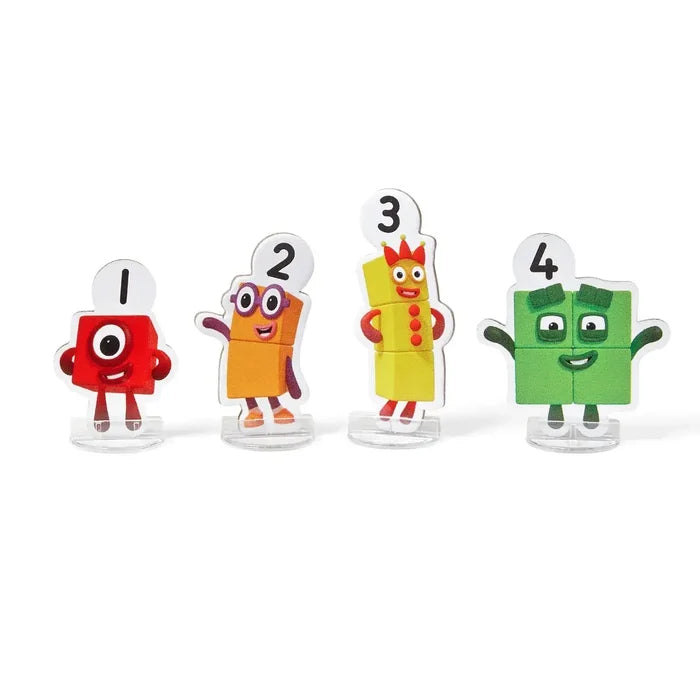Four acrylic standees of Numberblocks characters 1 to 4 in red, orange, yellow, and green on clear bases.