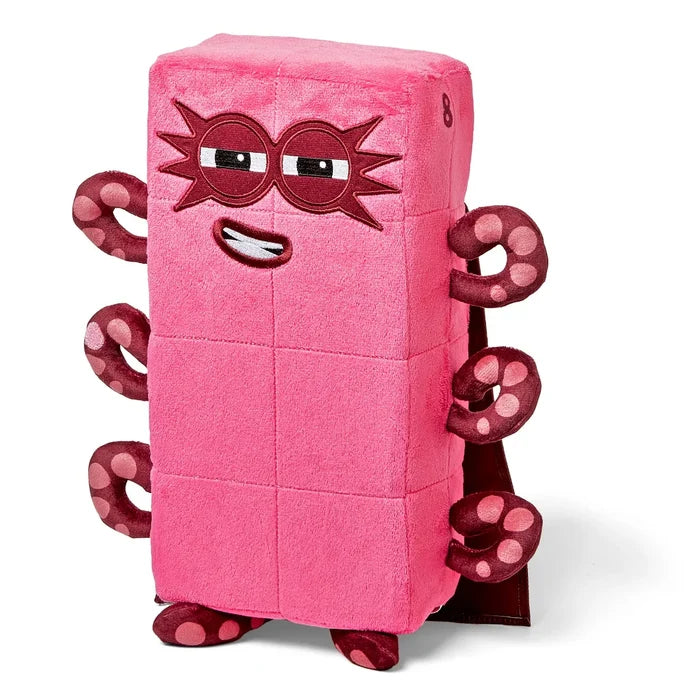 Rectangular pink plush toy with eight spotted maroon tentacles, a maroon superhero mask, and a maroon cape.