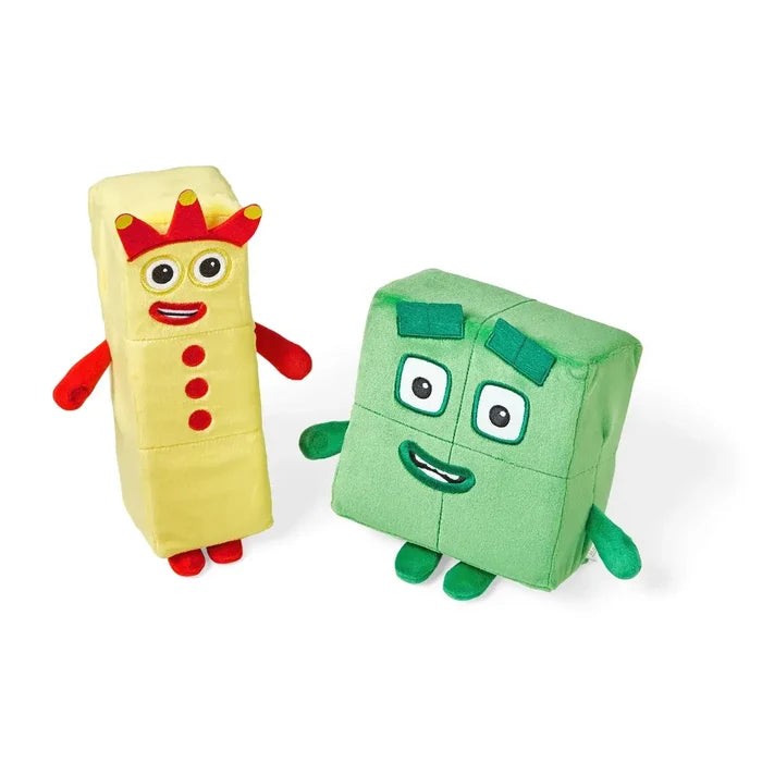 Yellow plush with a red crown and three buttons next to a green square plush toy with four blocks.