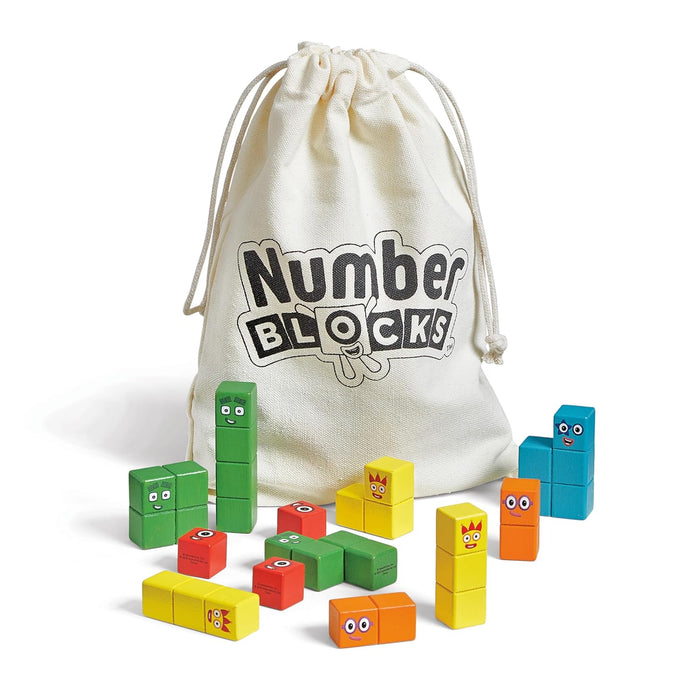Colorful wooden blocks with character faces stacked next to a white drawstring bag featuring the Numberblocks logo.