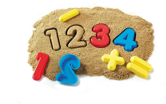 Red, blue, and yellow plastic number and math symbol moulds shown with imprinted numeric shapes in kinetic sand.
