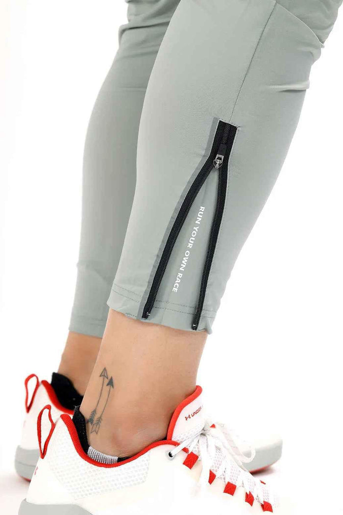 Light grey Nylon Supreme track from Fuaark Nz, showcasing the sleek design and lightweight nylon material.