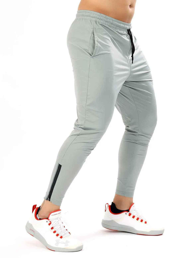 Light grey Nylon Supreme Tracks by Fuaark Nz, showcasing sleek track pants with a comfortable fit and modern design.