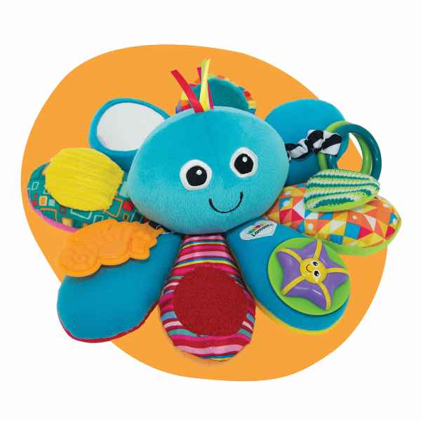 Plush blue octopus toy with colorful textured legs, a mirror, and a rattle ring against a circular orange background.