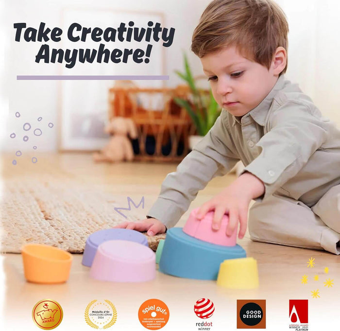 Child stacking colorful pastel bowls on a floor. Includes award logos and Take Creativity Anywhere! text.