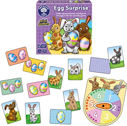 Purple box with bunnies holding eggs, plus bunny and egg cards and a colorful spinner with a carrot pointer.