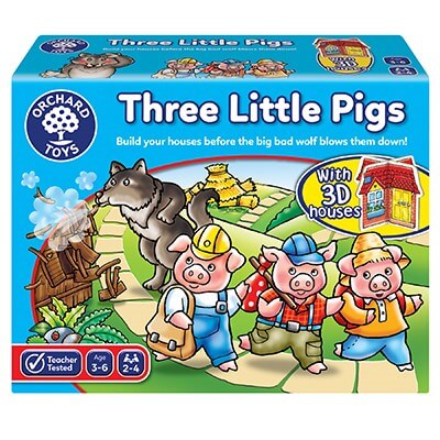 Blue square Orchard Toys box for Three Little Pigs game with cartoon pigs on a path and a wolf blowing down a house.