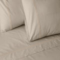 Organic cotton coloured sheet set in Dune by Whites of London NZ, featuring soft, natural-toned bedding with matching pillowcases.