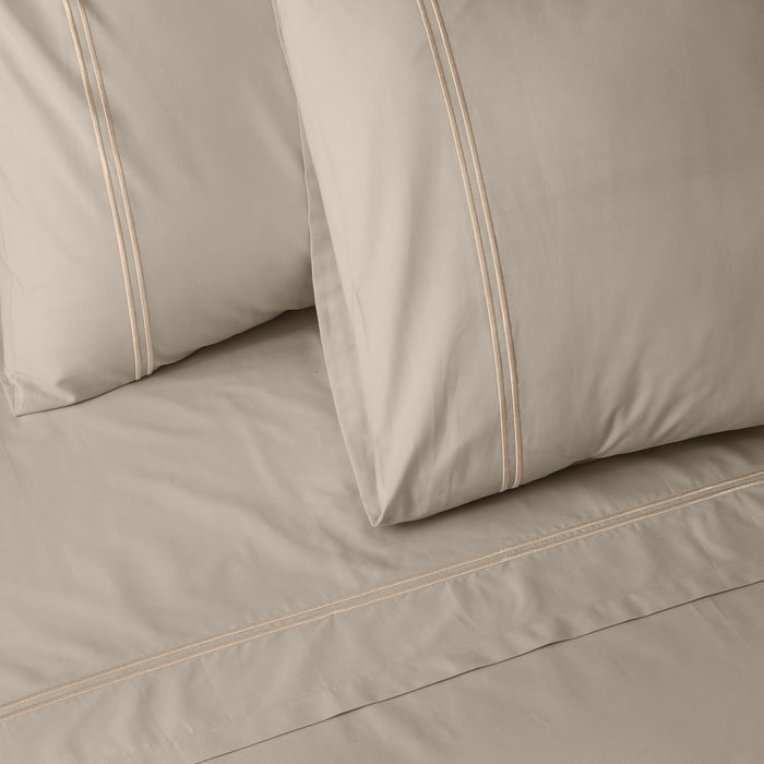 Organic cotton coloured sheet set in Dune by Whites of London NZ, featuring soft, natural-toned bedding with matching pillowcases.